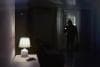 Burglar entering a room at night