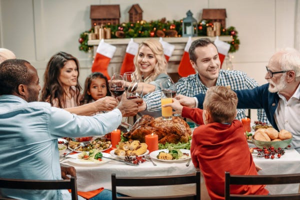 Picture of family eating dinner at during the holidays